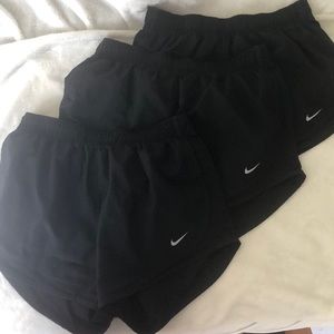 Three pairs of Nike medium size shorts